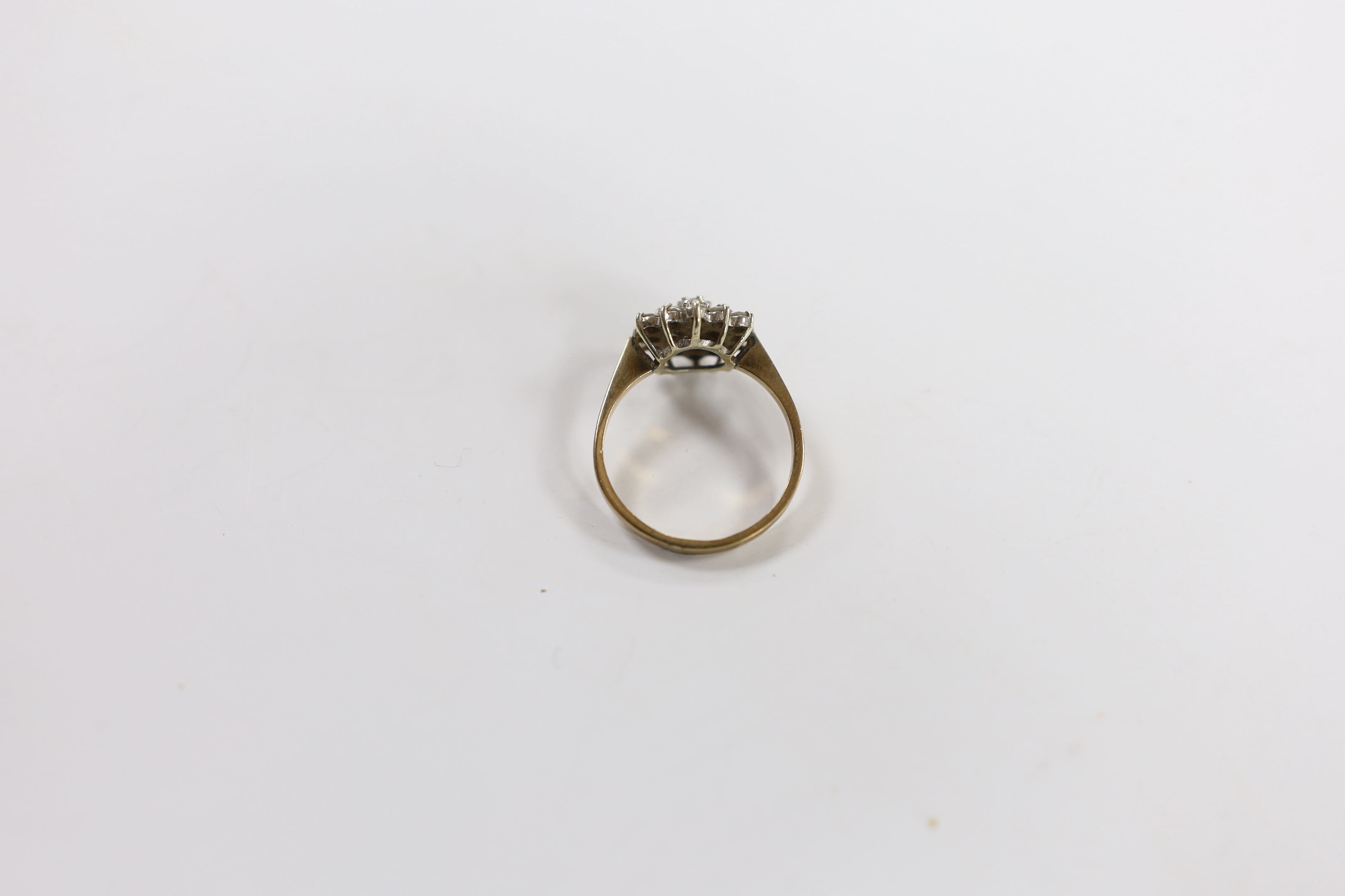 A modern 9ct gold and diamond cluster set flower head ring, size P/Q, gross weight 2.9 grams.